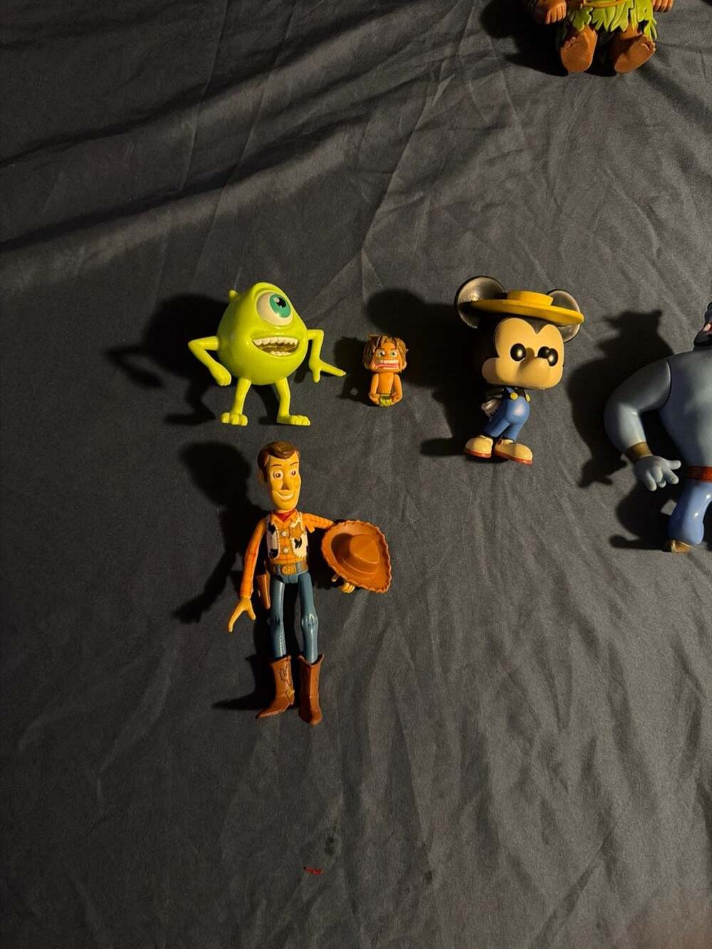 Disney and Pixar Character Figure Lot including 1992 Mattel Genie, Woody, Mickey